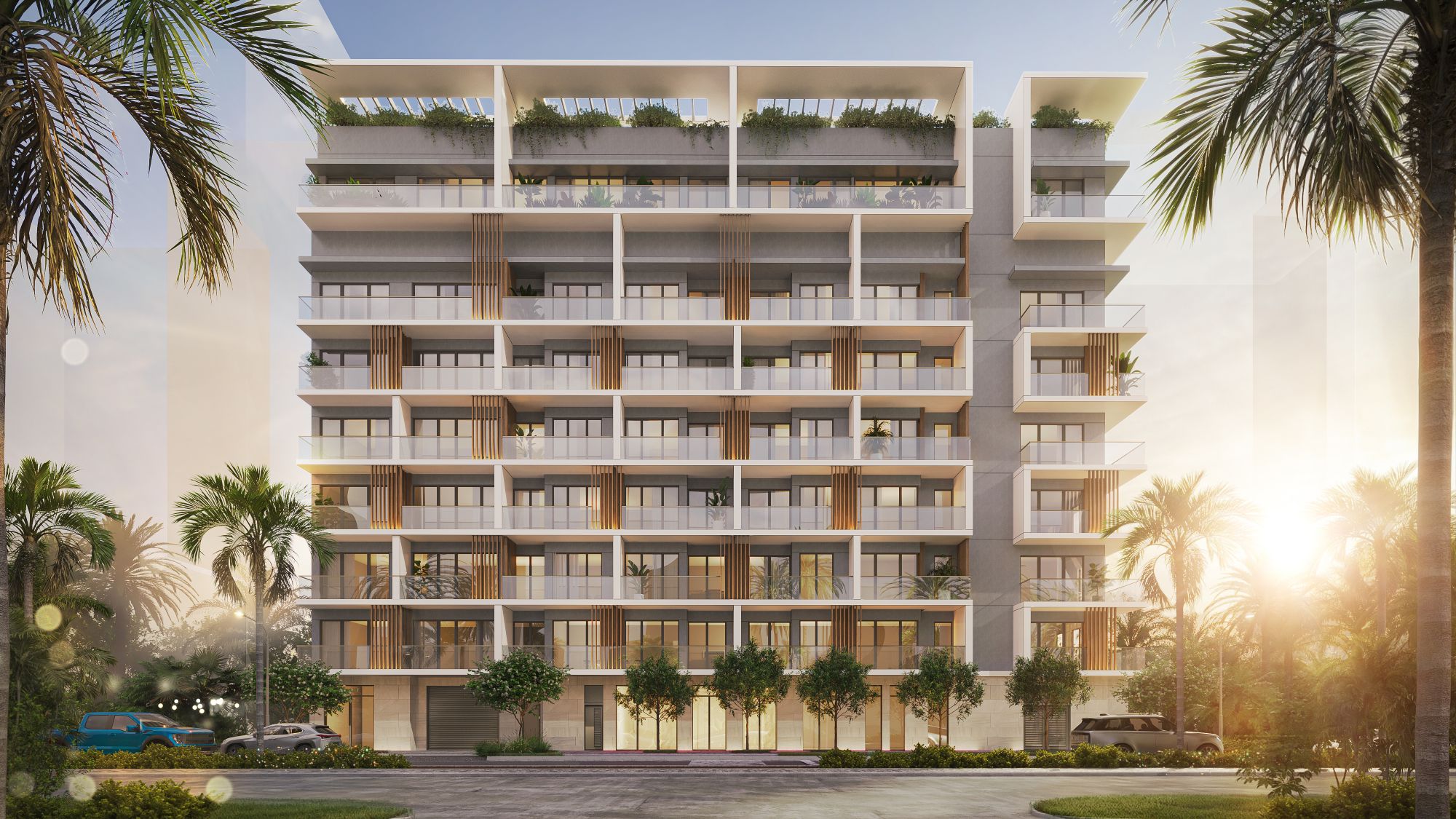 Fachada frontal de Parkside Residences at Brickell con balcones, paneles de madera y vegetación en la azotea